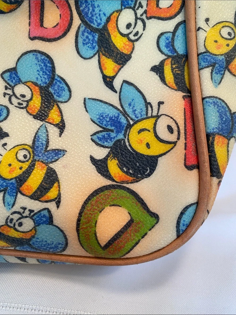 Dooney & Bourke Bee Print Satchel in Tan and Cream with Blue & Yellow Accents